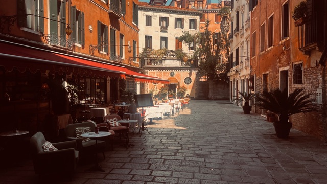 An intimate Venetian courtyard framed by warm historic architecture