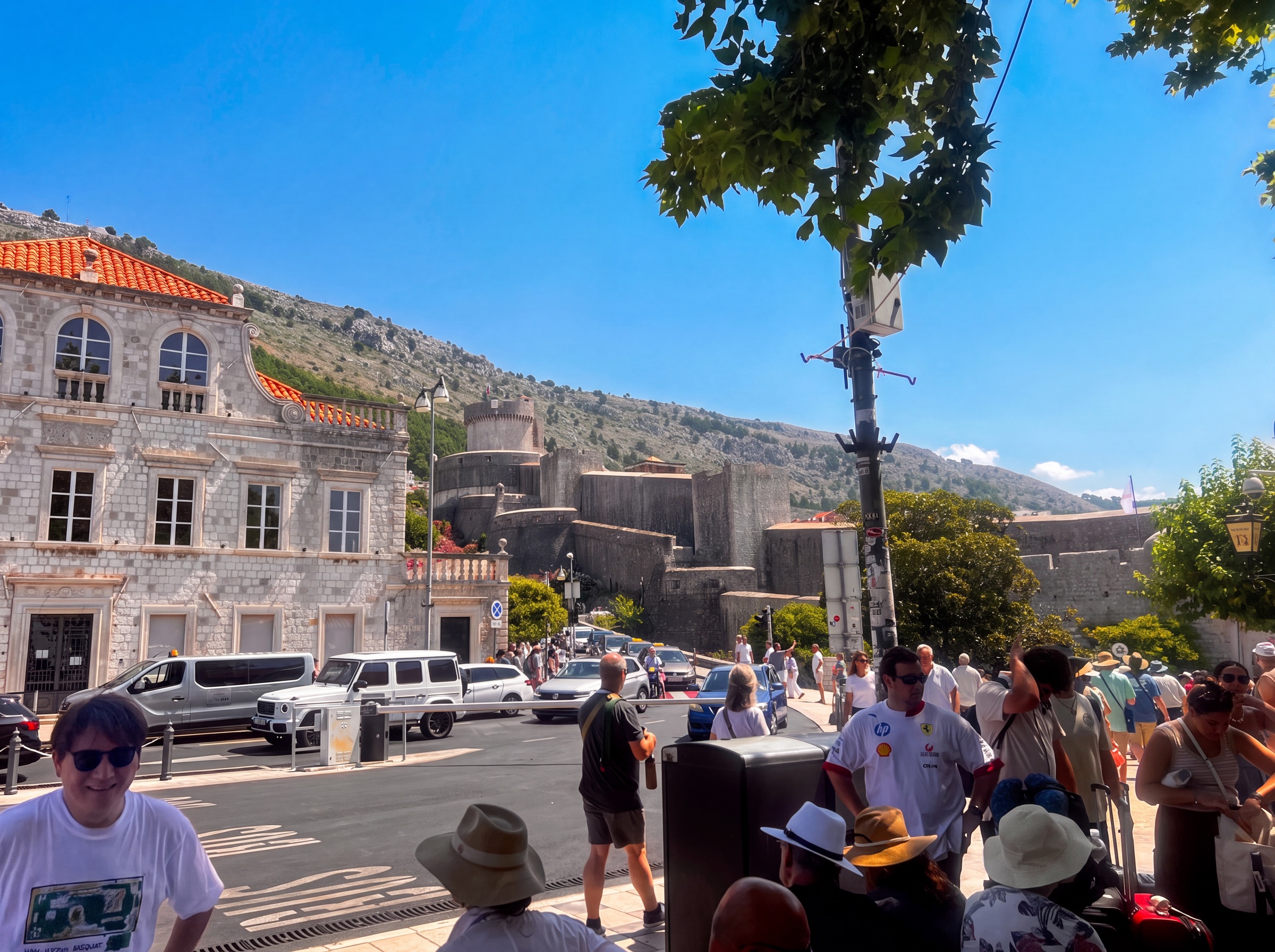 Dubrovnik fortifications and stone buildings near a busy Old City entrance